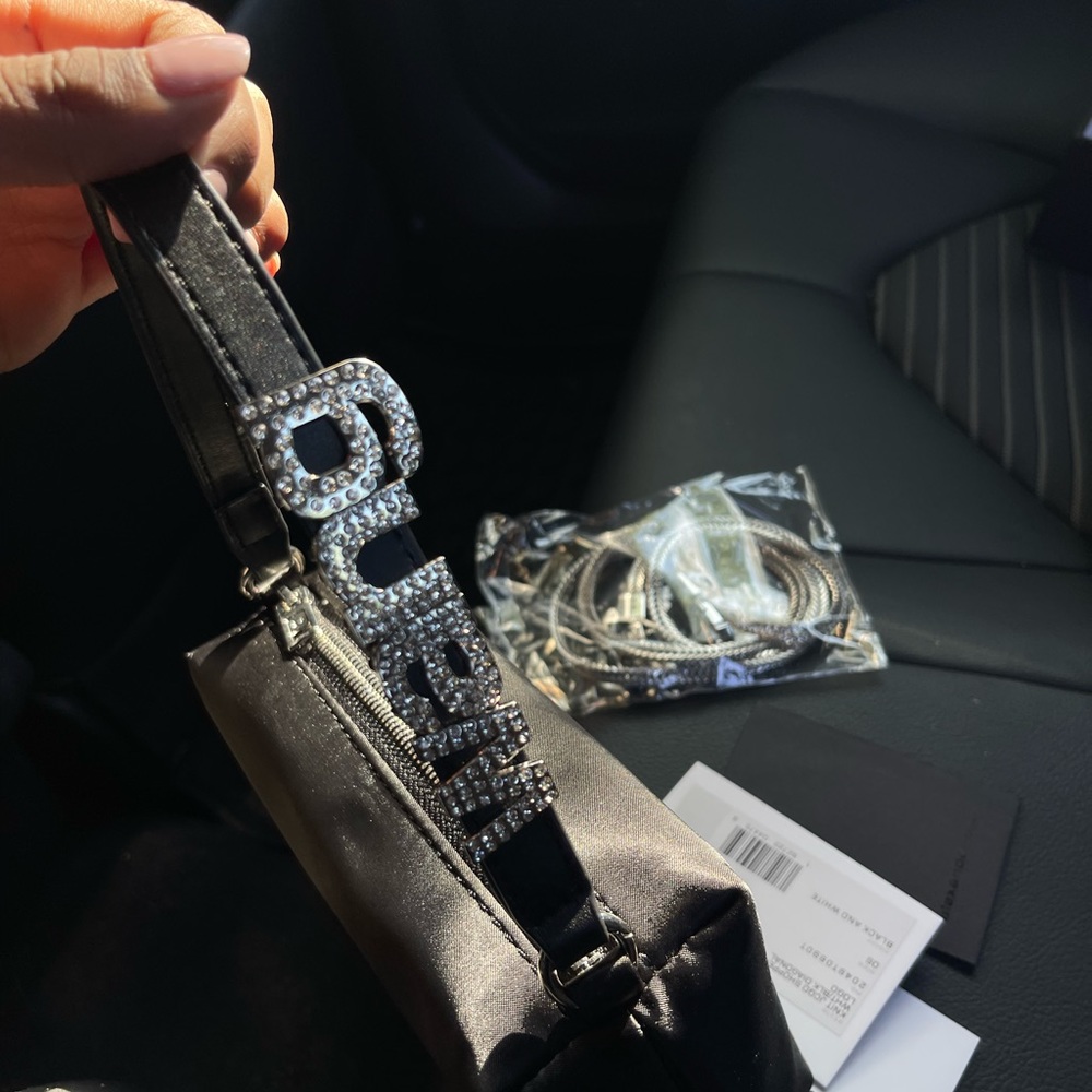 medium-sized satin pouch with a webbed nylon crystal logo top handle